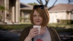 Karen sips on the hot chocolate she stole from her neighbor's child. 
 (Image courtesy of IMDb)